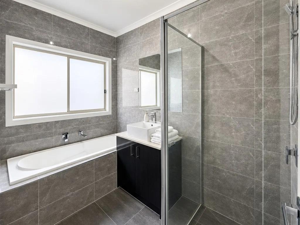 The same tired bathroom after Enhancia's AI edit