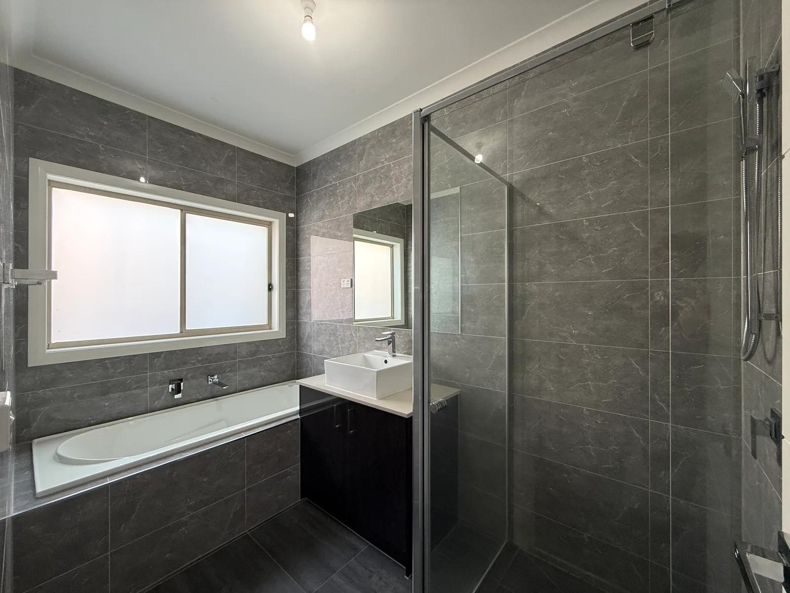 Same bathroom after AI enhancement with brighter, cleaner listing presentation before