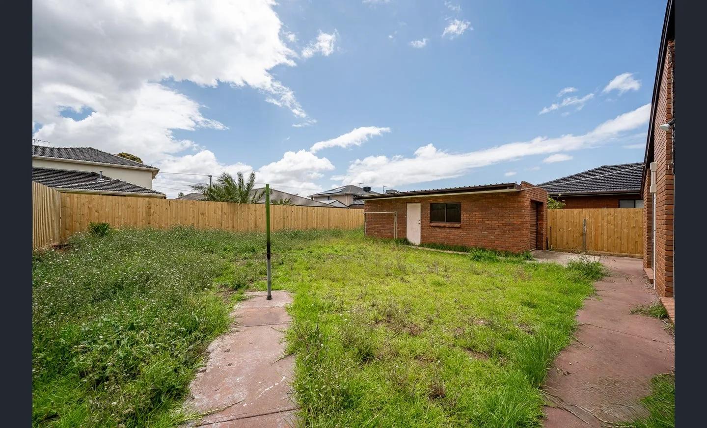 Same property lawn after AI grass enhancement with cleaner, more even presentation before